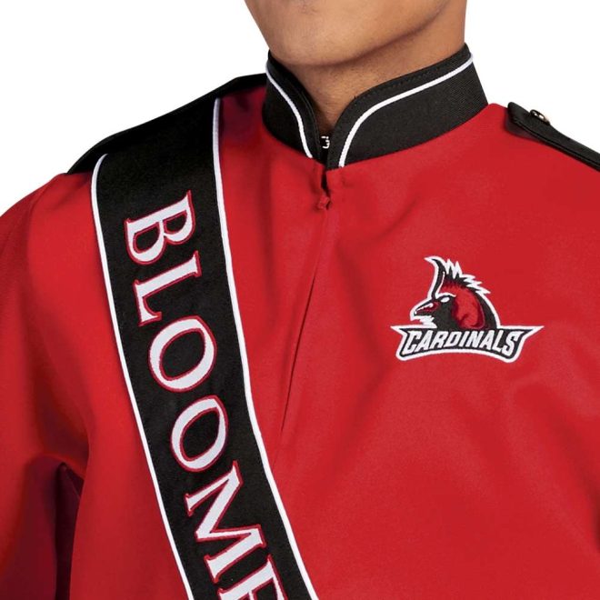 Close up of custom red with black and white detailing marching band uniform long sleeve. Black diagonal stripe with BLOOMFIELD written and cardinal on left chest. Front view with matching shako, black gloves, and black pants