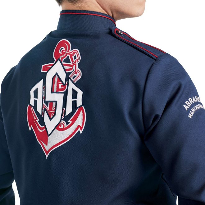 Custom navy with white and red detailing marching band uniform long sleeve. Back view with matching baylay parade cap, white gloves, and navy pants