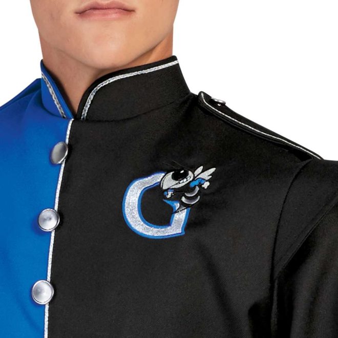 Close up of customization on left chest of royal and black marching band uniform. Customized with silver G outlines in royal with black, silver, and royal bee