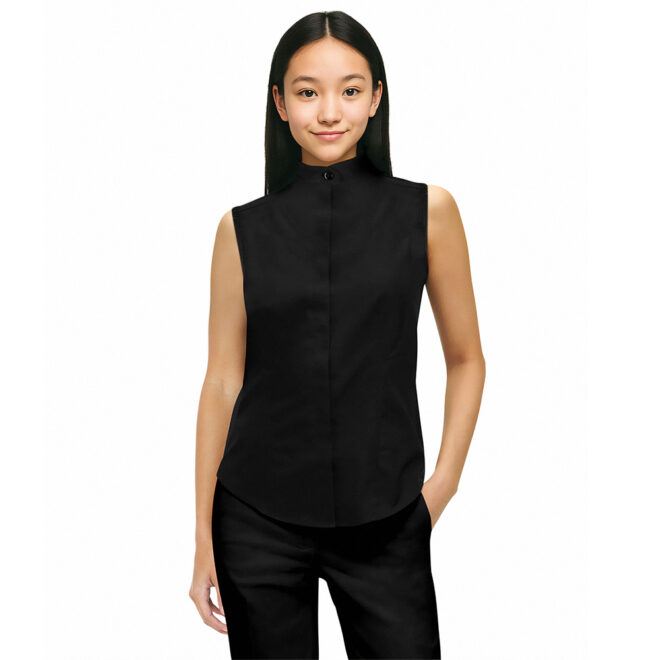 smiling model wearing a black band-collar sleeveless shirt and black pants with one hand in her pocket, front view