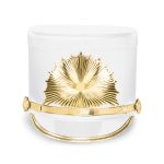 white marching shako with gold hardware and a gold starburst emblem