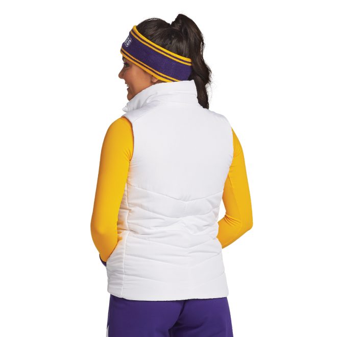 white port authority puffy vest back view over yellow long sleeve paired with purple pants and purple/yellow headband