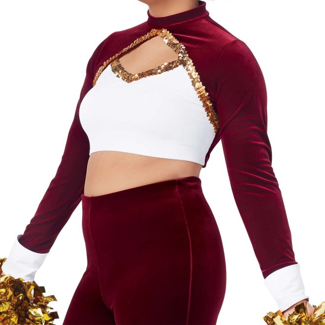 custom maroon long sleeve with white chest and cuffs and keyhole bodice with gold sequin trim crop top with matching maroon pants majorette uniform front view on model holding gold poms