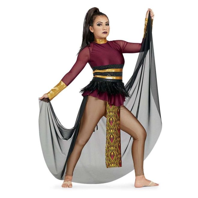 Custom long sleeve legging color guard unitard. Maroon mesh sleeves with gold cuffs and neck. Black and gold striped belt with black feathers over solid marron body. Brown leggings with small gold and maroon patterned fabric hanging in front from waist to below knee. Black mesh half skirt in back. Front view on model