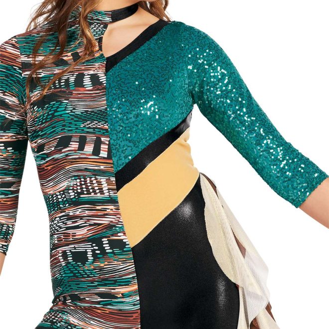 Close up custom 3/4 sleeve color guard unitard. Right half turquoise, brown, and black pattern legging pant. Left half cutout between shoulder and neck. Black collar, turquoise sequin sleeve and shoulder continuing at angle to middle of back. Thick stripe of gold at angle, black short, all colors separated by thin strip of black. Front view on model brown and white ruffle coming off left hip