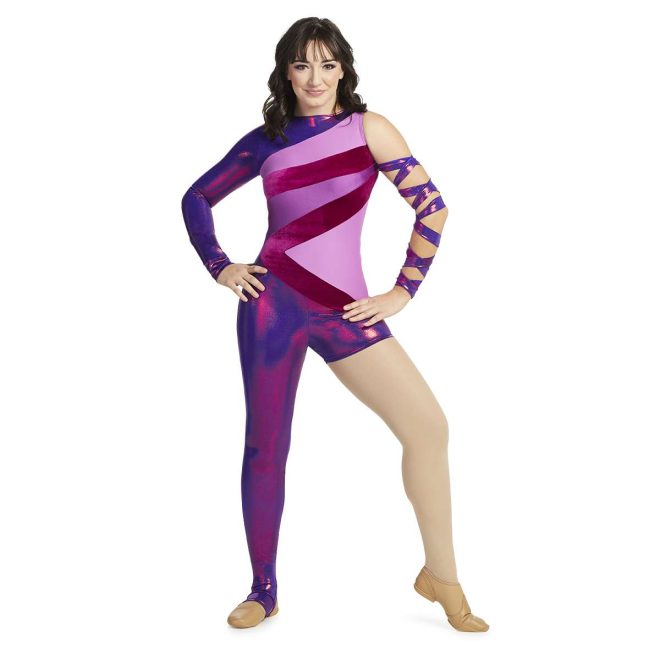 Custom color guard unitard. Right arm sleeveless, left arm long sleeve metallic purple. Body has pieces of shades of purple. Right leg long legging left leg boy short both are metallic purple. Front view on model with metallic purple fabric wrapped around left arm