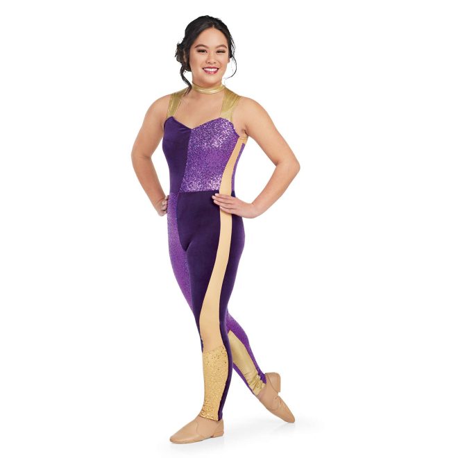 Custom sleeveless legging color guard unitard. Gold straps and neck with cutout upper chest, right chest and left leg velvet purple. Left chest and right leg purple sequin. Right side has gold sequin stripe from under arm to knee and solid gold inside leg from knee down. Left side has gold stripe from under arm to knee and sequin gold from knee down and solid gold on inside leg from knee down. Front view on model