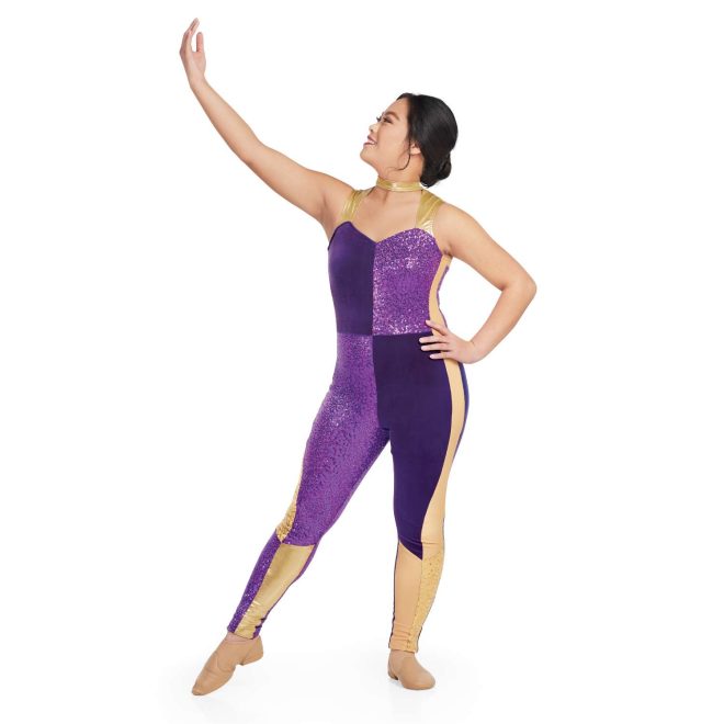 Custom sleeveless legging color guard unitard. Gold straps and neck with cutout upper chest, right chest and left leg velvet purple. Left chest and right leg purple sequin. Right side has gold sequin stripe from under arm to knee and solid gold inside leg from knee down. Left side has gold stripe from under arm to knee and sequin gold from knee down and solid gold on inside leg from knee down. Front view on model