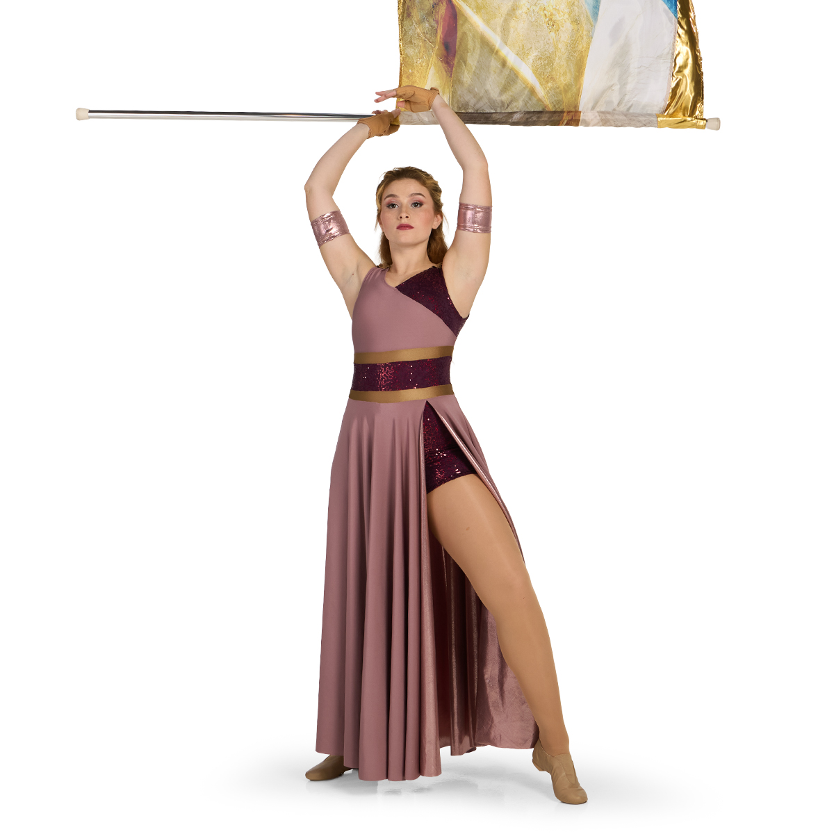 Color guard performer wearing a mauve, burgundy, and sable custom sleeveless color guard dress with built in boy shorts holding a flag overhead, front view.