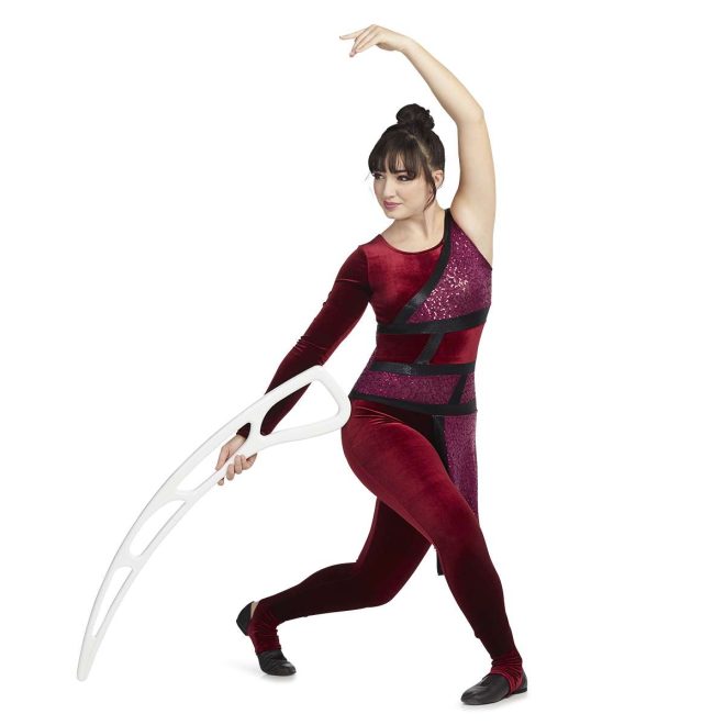 Custom legging color guard unitard. Left sleeveless, right long sleeve velvet maroon. Front body mixture of maroon velvet and sequin separated by stripes of black. Pants are velvet maroon separated from top by black stripe. Maroon sequin drape off left hip. Front view on model holding airblade