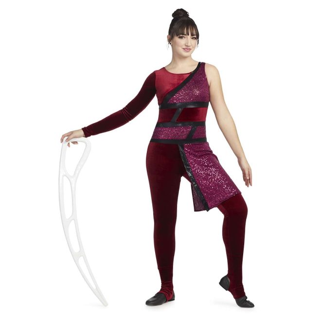 Custom legging color guard unitard. Left sleeveless, right long sleeve velvet maroon. Front body mixture of maroon velvet and sequin separated by stripes of black. Pants are velvet maroon separated from top by black stripe. Maroon sequin drape off left hip. Front view on model holding airblade