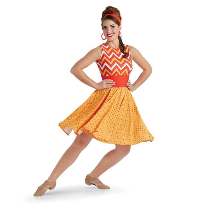 custom sleeveless oranges color guard knee length dress with chevron top solid orange belt and polka dot skirt front view on model with orange headband and earrings