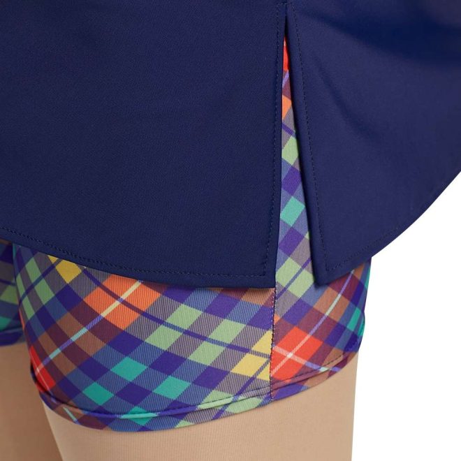 custom navy dress with printed checkered orange, green, yellow and blue biker shorts under color guard uniform front view on model