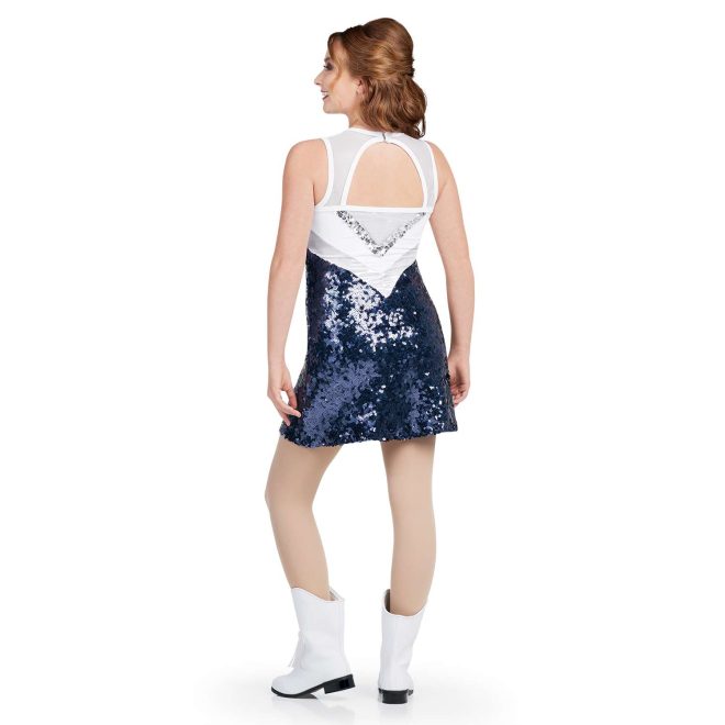 custom white, silver sequin, and navy sparkly sleeveless a-line majorette dress with attached boyshorts with keyhole back, back view on model wearing white boots