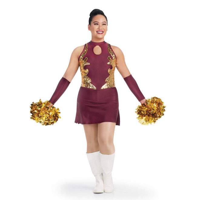 custom maroon sleeveless a-line with keyhole bodice and gold sequin detailing twirler dress with side slits and attached briefs front view on model wearing maroon arm mitts and white boots holding gold poms