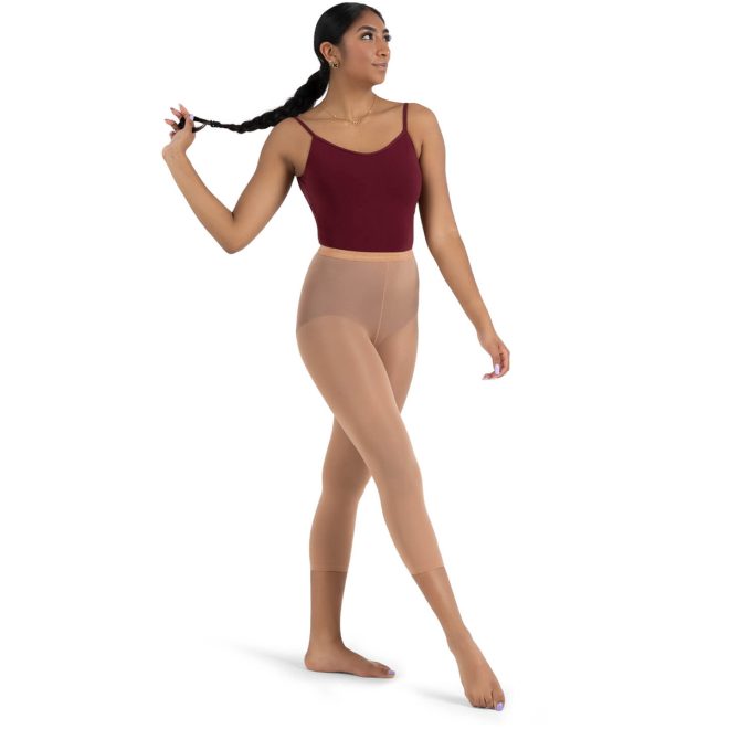 Model wearing Suntan Capezio Ultra Hold Footless Tight, Front Three-quarters View