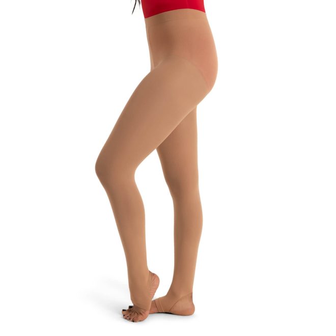 Model in a red bodysuit wearing Caramel Capezio Ultra Soft Stirrup Tights, side view