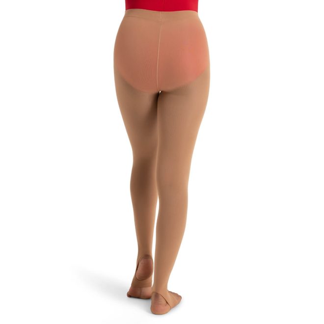 Model in a red bodysuit wearing Caramel Capezio Ultra Soft Stirrup Tights, back view