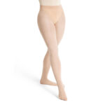 Model wearing natural color Capezio Ultra Soft Transition Tights, front three-quarters view