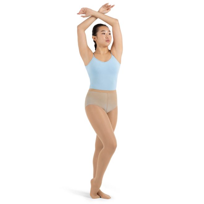 Model wearing caramel Capezio Ultra Hold Footed Tights, front three-quarters view