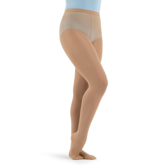 Model wearing caramel Capezio Ultra Hold Footed Tights, front three-quarters view