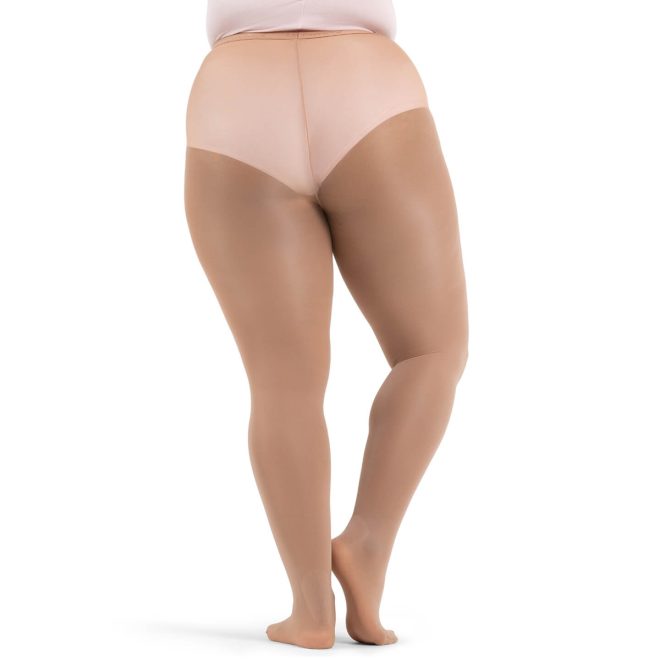 Model wearing light suntan Capezio Hold and stretch plus sized Footed Tights, back view