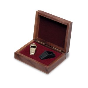 gold plated award whistle with dark brown wooden box with red felt