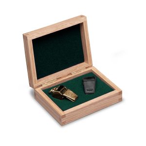 bronze award whistle with light brown wooden box with green felt