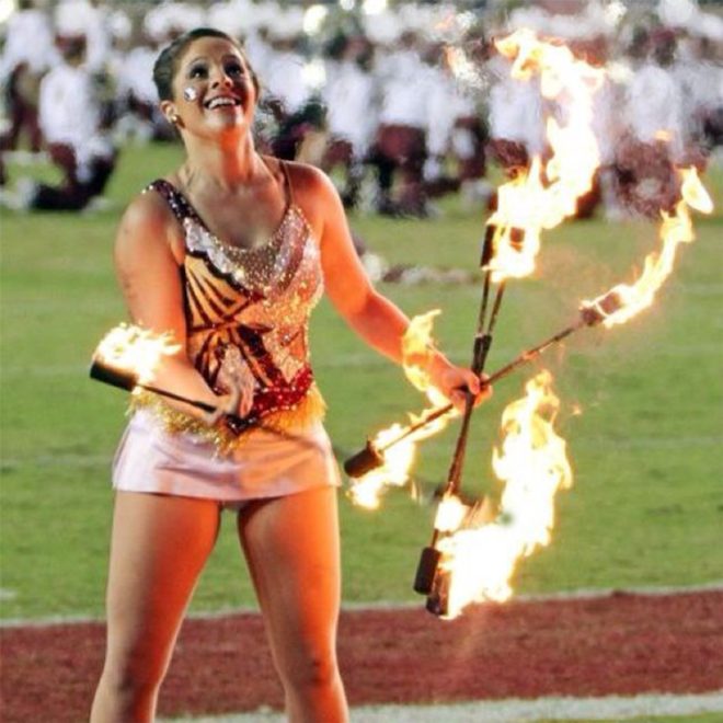 performer twirling star line twirling fire batons