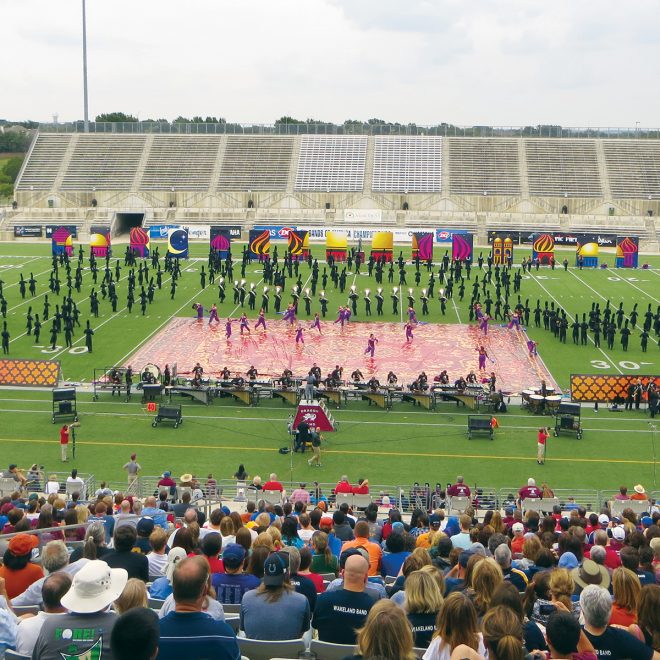 red and yellow digitally printed field and floor tarp used on football field during performance