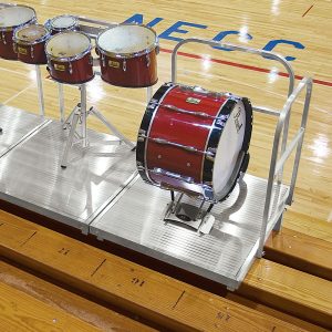 silver DSI moveable bleacher podium attached to bleachers inside with instruments