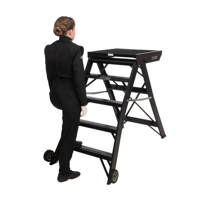 Black jarvis 52 inch marching band podium with safety rails, with model for size comparison