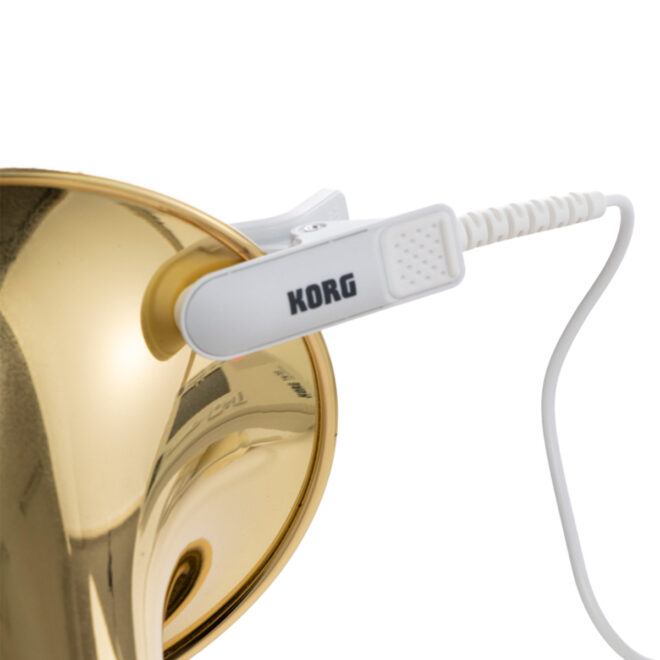 white KORG CM400 Contact Mic clipped to a brass instrument