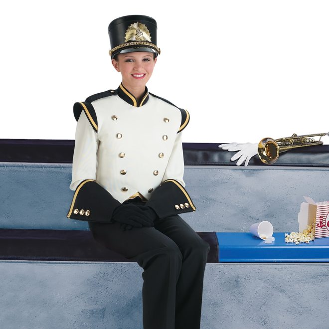 performer sitting on black bleacher cover