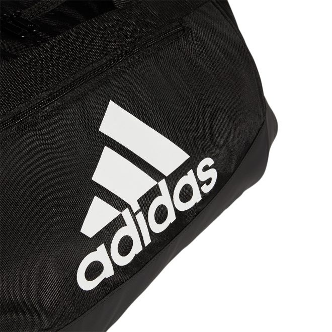 black and white adidas small defender iv duffel front view close up of logo