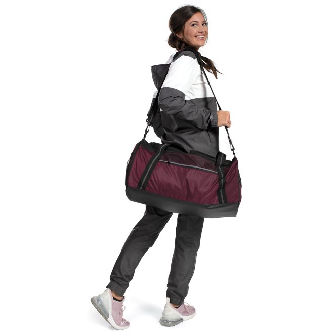maroon and black holloway rivalry duffel bag worn on shoulder back view