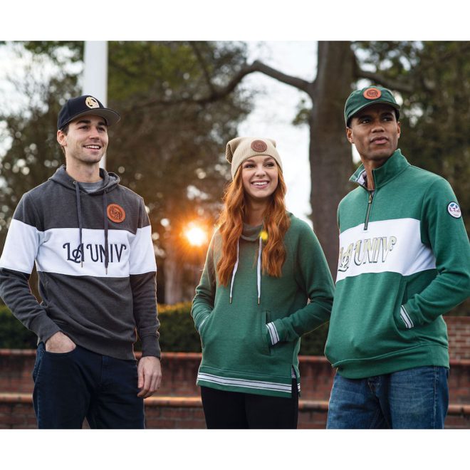 dark green holloway all american funnel neck pullover front view on model with carbon and green custom LA UNIV holloway all american hoodie front view on models in a park