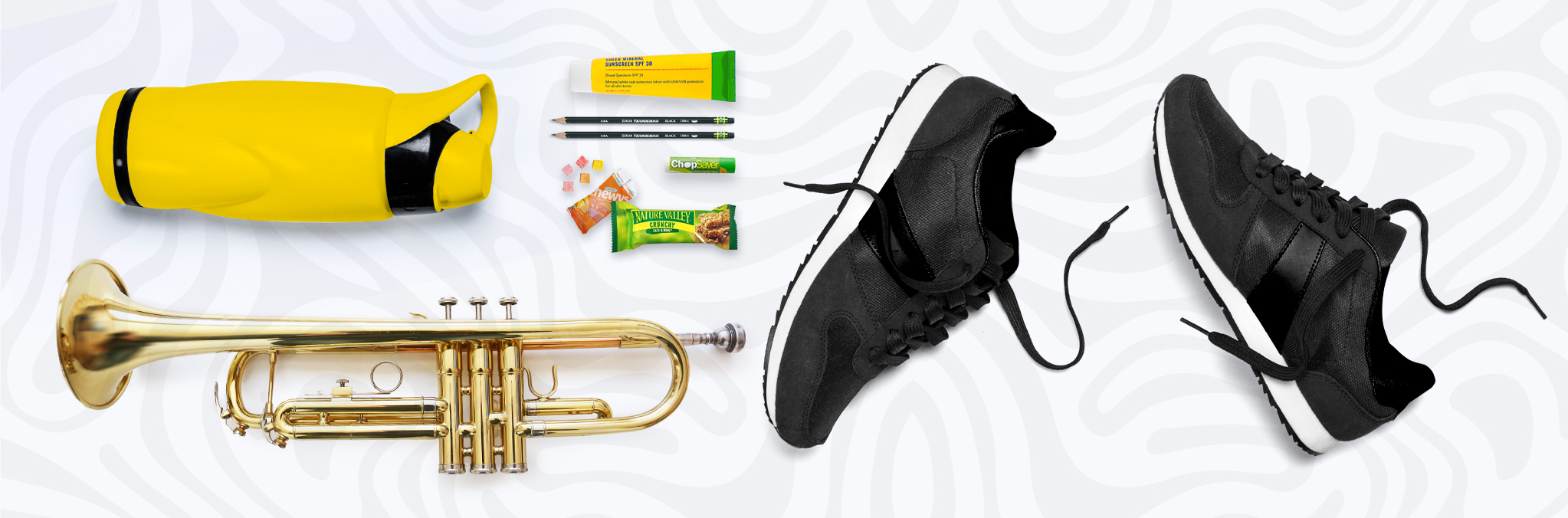 items for surviving band camp inlcuding shoes, water bottle, sun screen, pencils, lip balm, snacks and an instrument