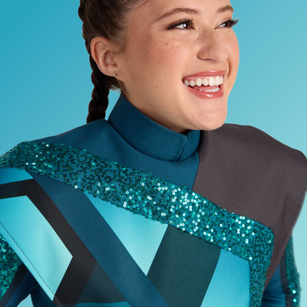 marching band performer in a teal and grey performance uniform smiling.